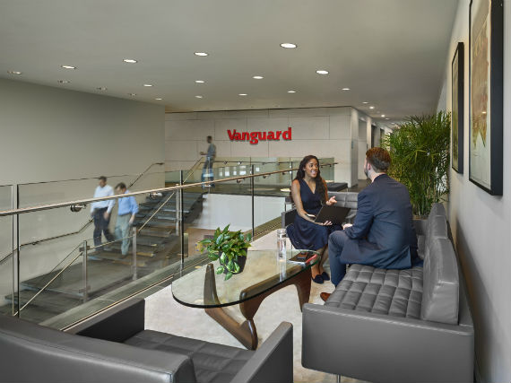 Two employees sitting in lobby area of Vanguard company building 